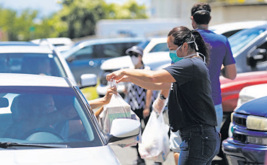 Help is on the Way Volunteer, Kimi Ide-Foster, Distributes Food to Seniors